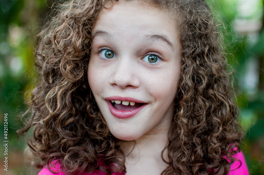 Portrait of girl looking at camera with surprised face Portrait of girl looking at camera with surprised face