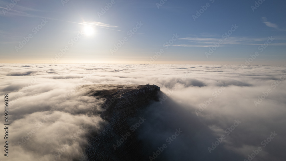 Mountain peak surrounded by clouds