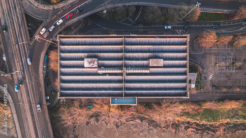 Building from above next to main road in autumn 