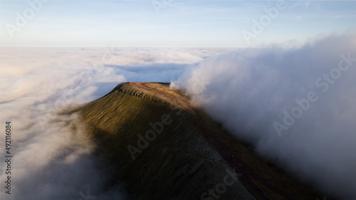 Mountain peak surrounded by clouds