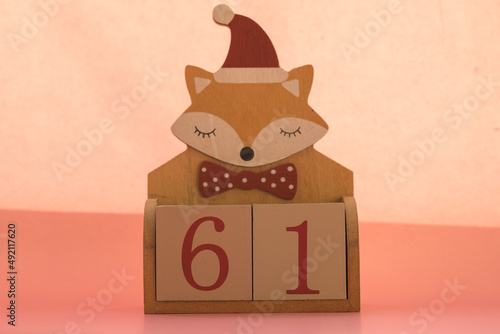 Numbers or dates on wooden cubes with fox, sixty-one photo