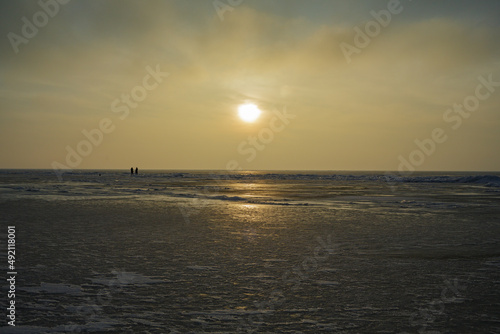 Frozen shore of the Kiev Sea at sunset