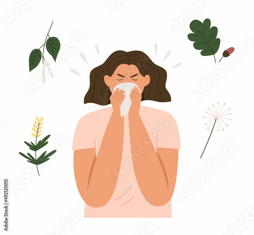 Woman sneezes from plant allergy