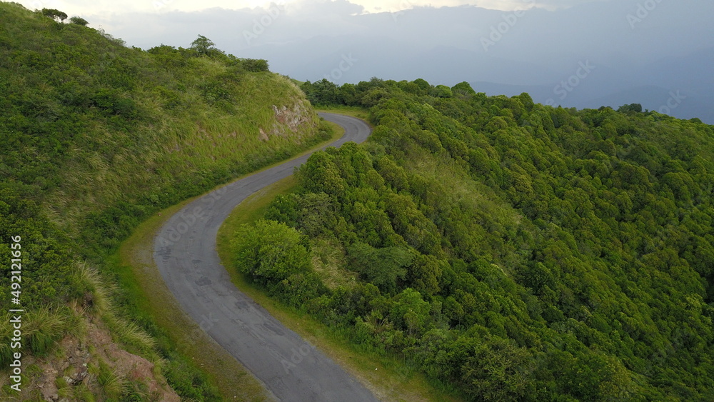beautiful mountain road in green landscape in northwest Argentina
