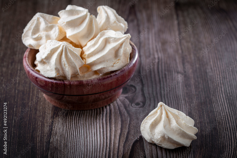 Delicious meringue cookies on the table.