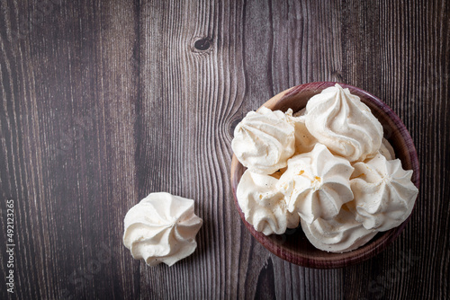 Delicious meringue cookies on the table.