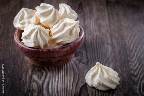 Delicious meringue cookies on the table.