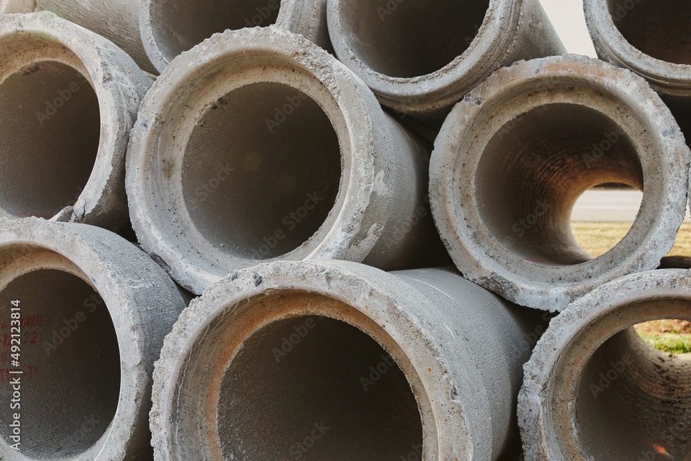Macro view of concrete pipes stacked up high. Macro view of concrete pipes stacked up high.