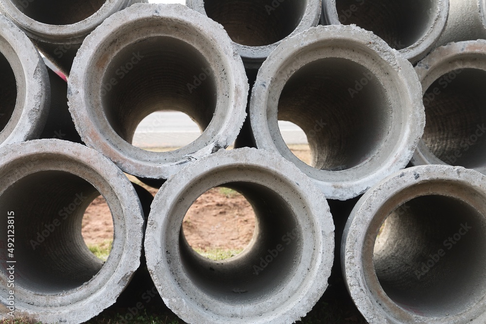 Macro view of concrete pipes stacked up high. Macro view of concrete pipes stacked up high.
