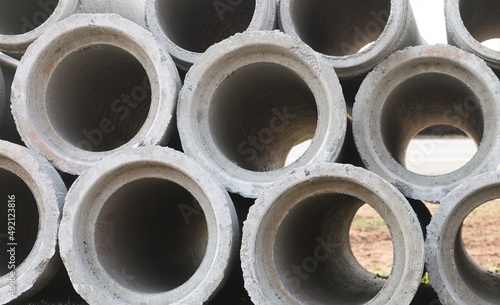 Macro view of concrete pipes stacked up high. © marls