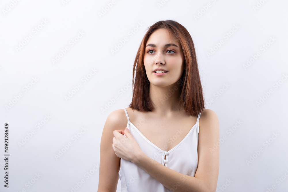 Beautiful smiling woman with clean skin, natural make-up and white teeth on a gray background Beautiful smiling woman with clean skin, natural make-up and white teeth on a gray background