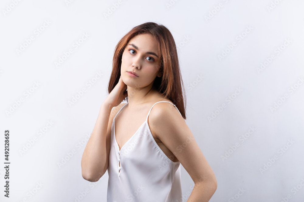 Beautiful smiling woman with clean skin, natural make-up and white teeth on a gray background Beautiful smiling woman with clean skin, natural make-up and white teeth on a gray background