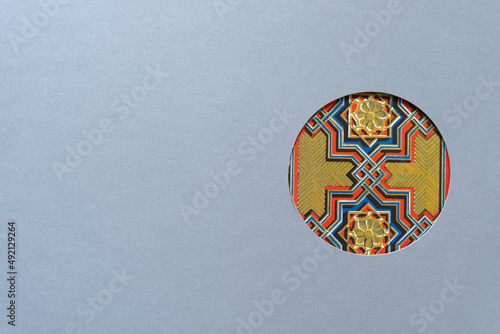 Принти на полотні paper with circle hole with decorative star pattern