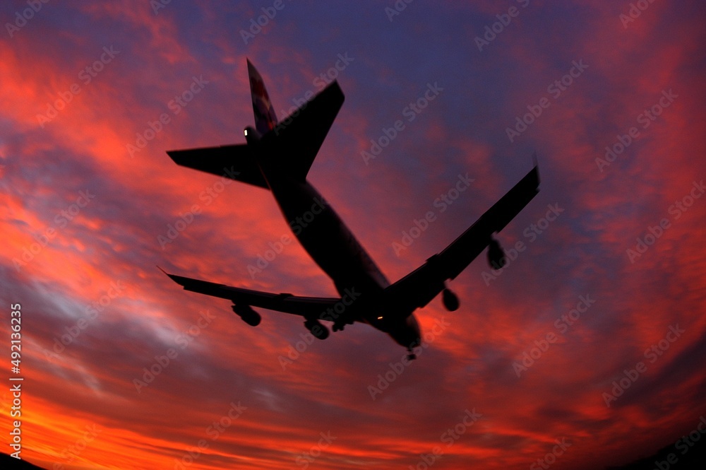 Silhouette of airplane in evening sky Silhouette of airplane in evening sky