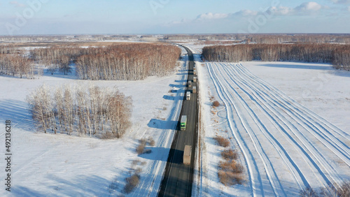 Trans-Siberian highway. Traffic on the Omsk - Novosibirsk AH6 "Irtysh" highway. Aerial view. © Eugene