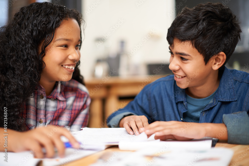 Getting a bit of after class help. Shot of two young students studying together in a classroom. Getting a bit of after class help. Shot of two young students studying together in a classroom.