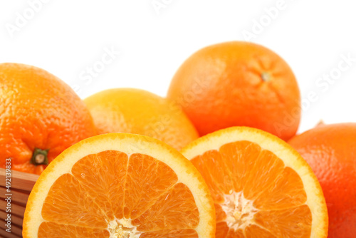 Whole orange fruit and  segments or cantles isolated on white background cutout