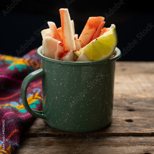 Принти на полотні Mexican yam bean also called Jicama with chili powder and chamoy sauce