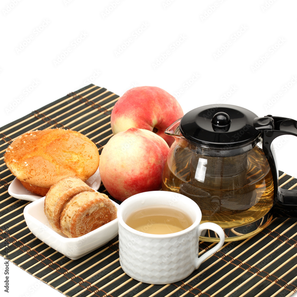 cake,cup and teapot of tea on white background cake,cup and teapot of tea on white background