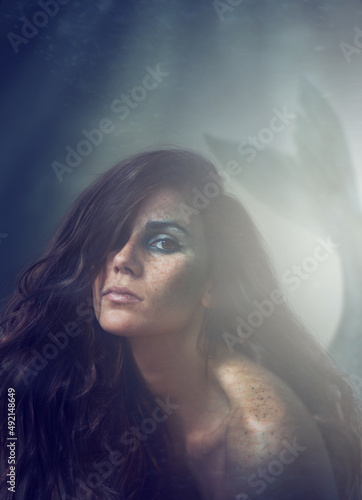 Oceans daughter. A cropped portrait of a beautiful mermaid - ALL design on this image is created from scratch by Yuri Arcurs team of professionals for this particular photo shoot.