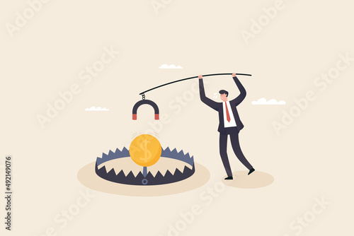 Money trap concept, financial risk metaphor. Businessman trying to reach money trap with dollar coin.