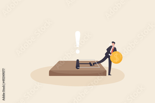 Money trap concept, financial risk metaphor. Businessman trying to reach money trap with dollar coin.