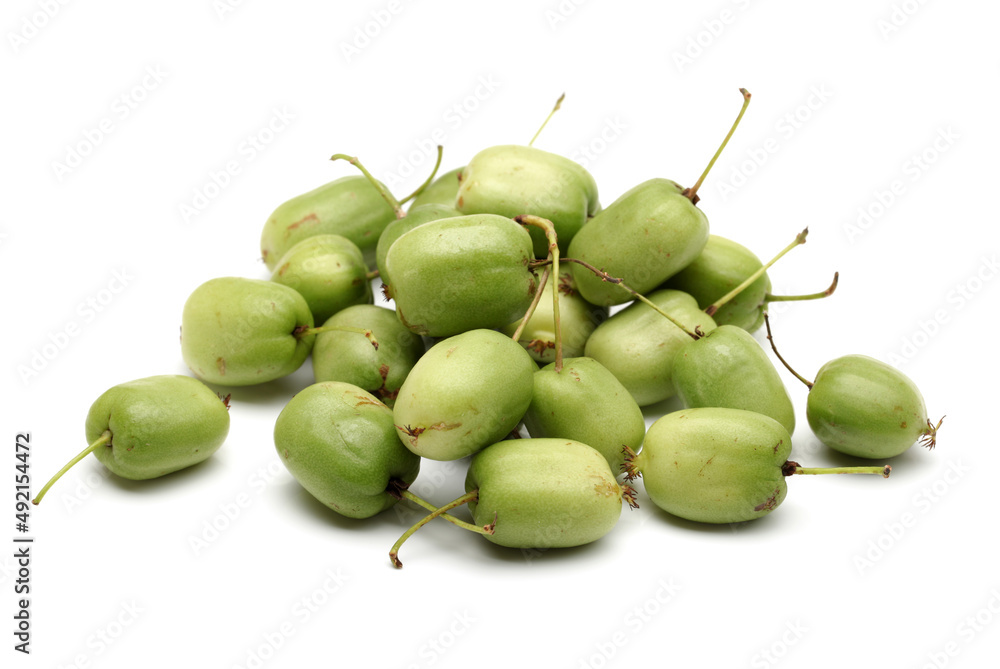 mini kiwi baby fruit (actinidia arguta) on white background mini kiwi baby fruit (actinidia arguta) on white background