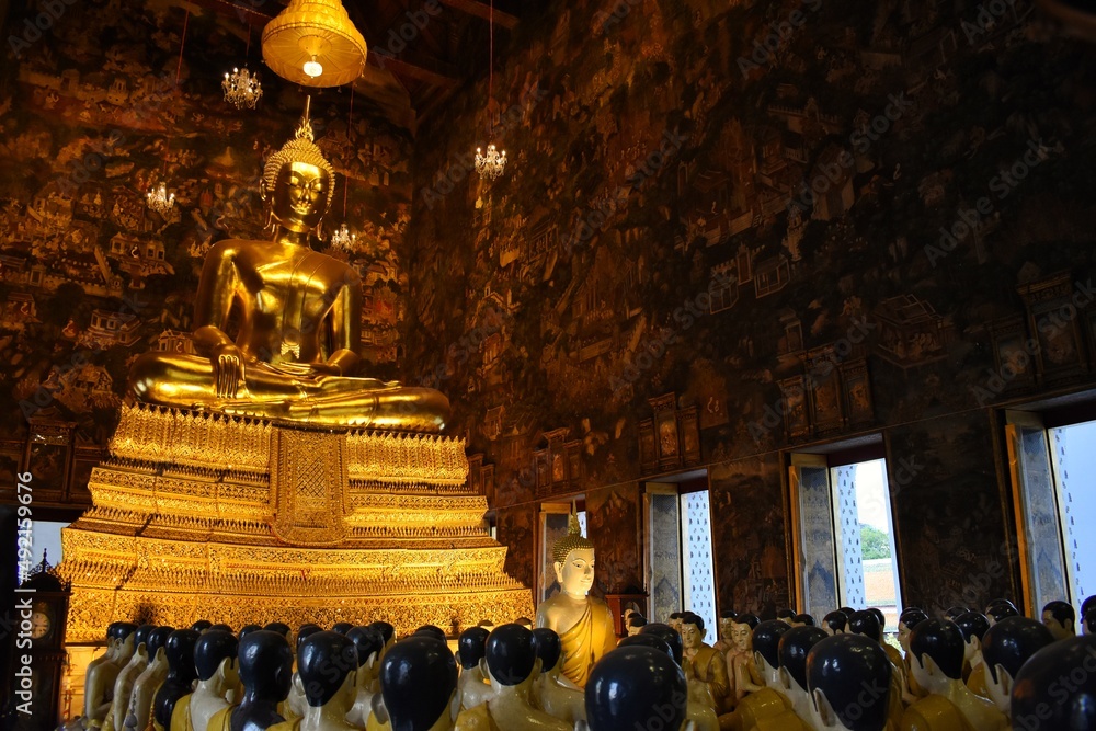 The Golden Buddha image Phra Sri Sakyamuni in the main chapel of Wat Suthat Thepwararam. Located in Bangkok, THAILAND.