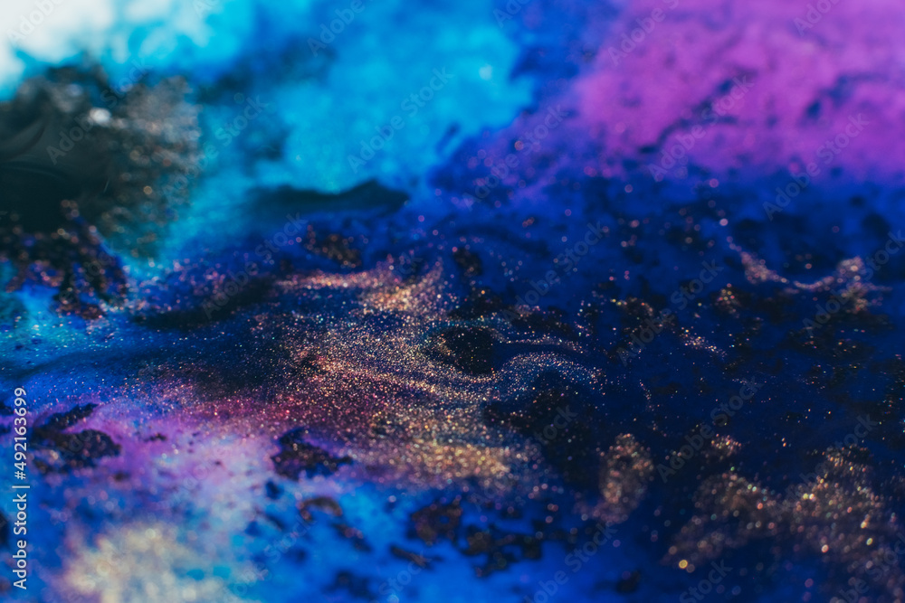 Ink blend. Artistic hobby. Colorful abstract bakgrund. Purple blue glitter paints mix Ink blend. Artistic hobby. Colorful abstract bakgrund. Purple blue glitter paints mix