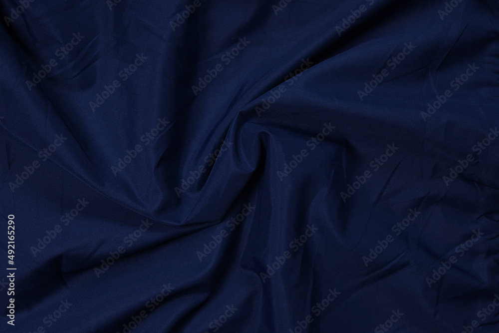 Obraz premium Blue fabric texture, background. folds close up. classic blue pantone