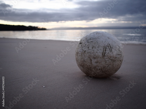 Worn sphere on the beach