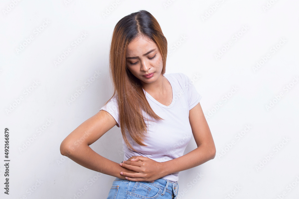 Young asian woman suffering low back pain and waist lumbar pain
Young asian woman suffering low back pain and waist lumbar pain