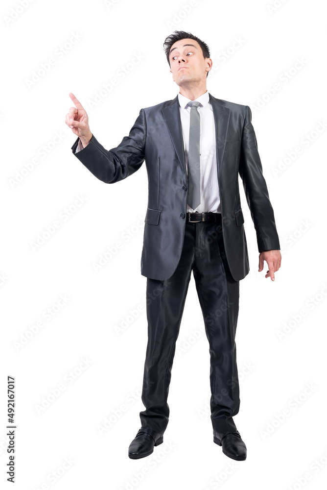 Serious man in suit pointing up. White background. Serious man in suit pointing up. White background.