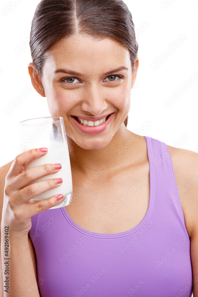 Keep calm and drink milk. Portrait of a beautiful woman holding a glass of milk. Keep calm and drink milk. Portrait of a beautiful woman holding a glass of milk.