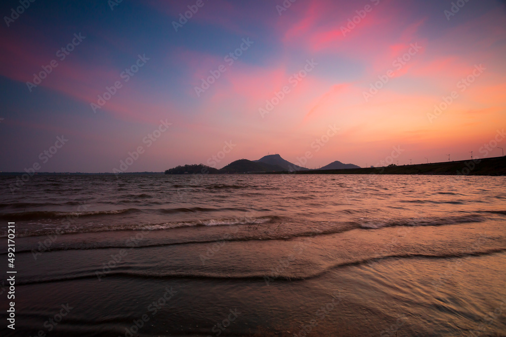 Amazing beautiful sunset on the sea with rock Amazing beautiful sunset on the sea with rock
