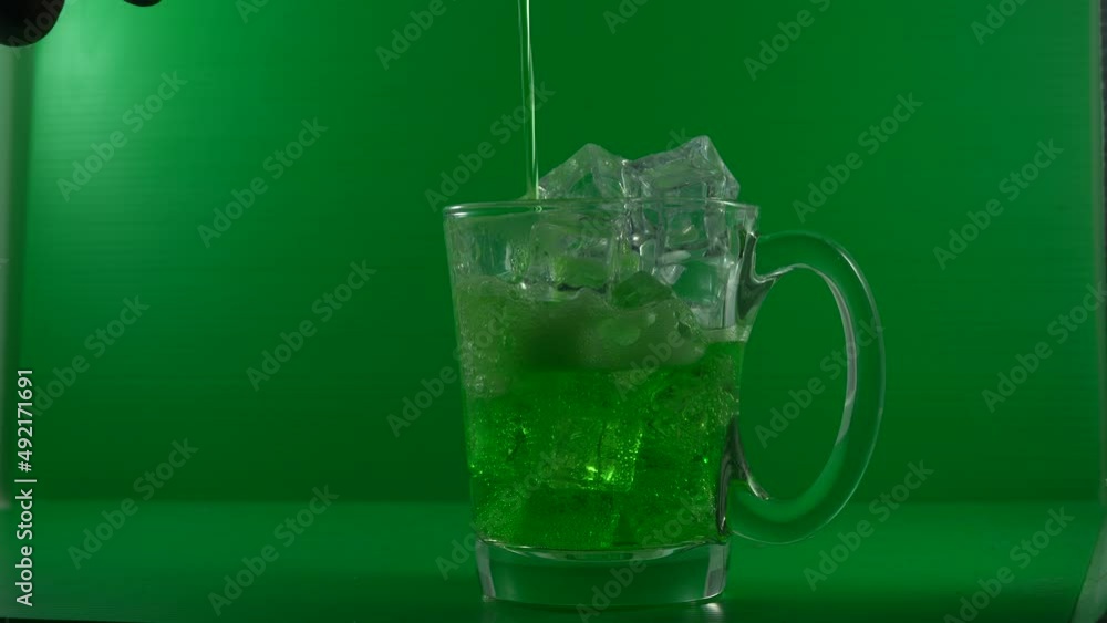 Macro shot of pouring a soft drink over ice in a glass cup. to quench thirst. Macro shot of pouring a soft drink over ice in a glass cup. to quench thirst.