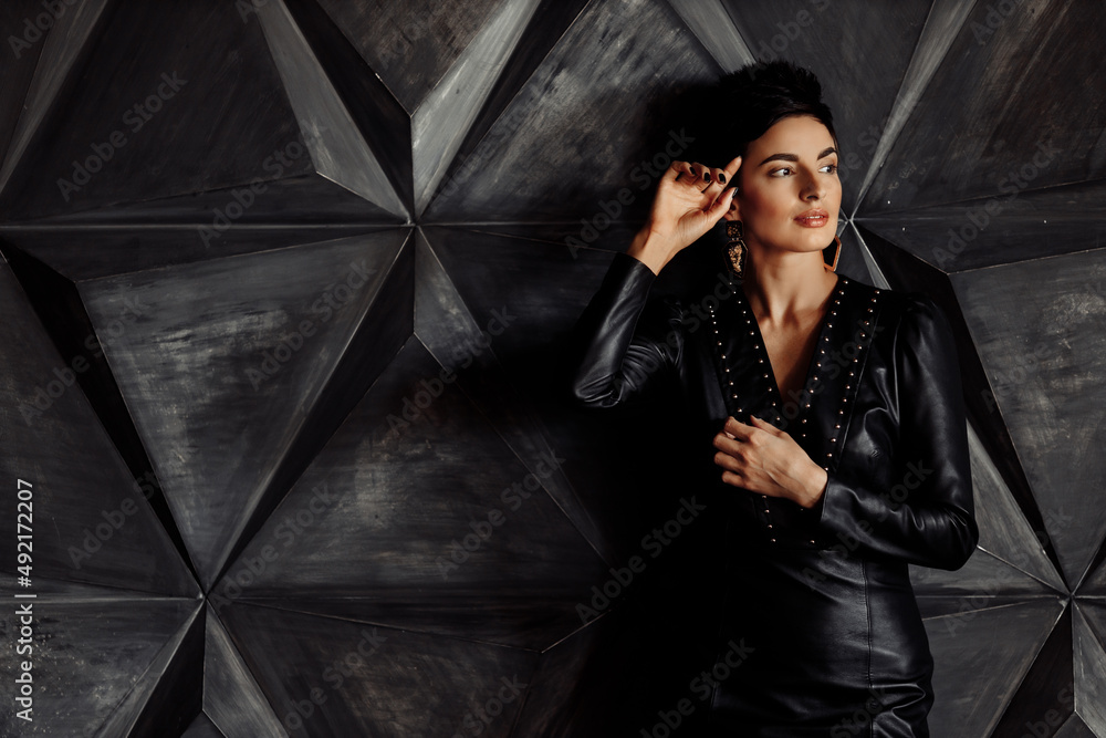 Portrait of serious elegant female leader look at the camera, wearing stylish dress. Beautiful elegant business woman posing with cross hands, attractive gorgeous lady boss show confidence and success Portrait of serious elegant female leader look at the camera, wearing stylish dress. Beautiful elegant business woman posing with cross hands, attractive gorgeous lady boss show confidence and success