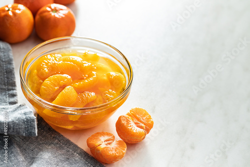 Canned tangerine. Pickled mandarin fruit in bowl. photo