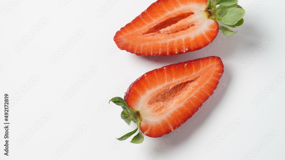 Sweet fresh strawberry halves cut on white background Sweet fresh strawberry halves cut on white background