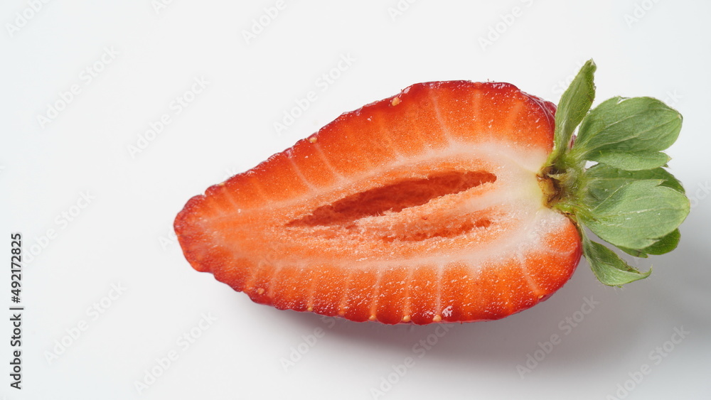 Sweet fresh strawberry half cut on white background Sweet fresh strawberry half cut on white background