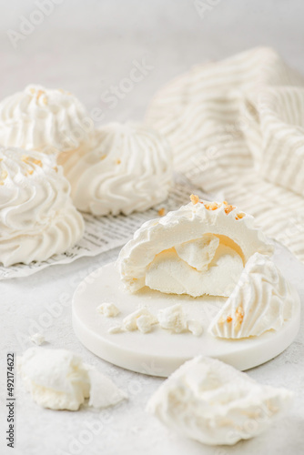 meringue on a white plate on white background