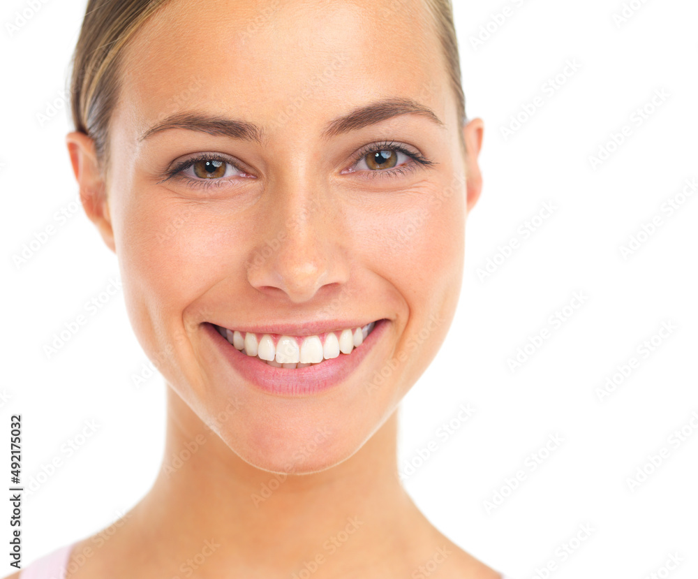 Theres perfection in her smile. Studio portrait of an attractive young woman smiling against a white background. Theres perfection in her smile. Studio portrait of an attractive young woman smiling against a white background.