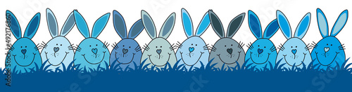 Osterhasen blau verstecken sich im dunkelblauen Rasen