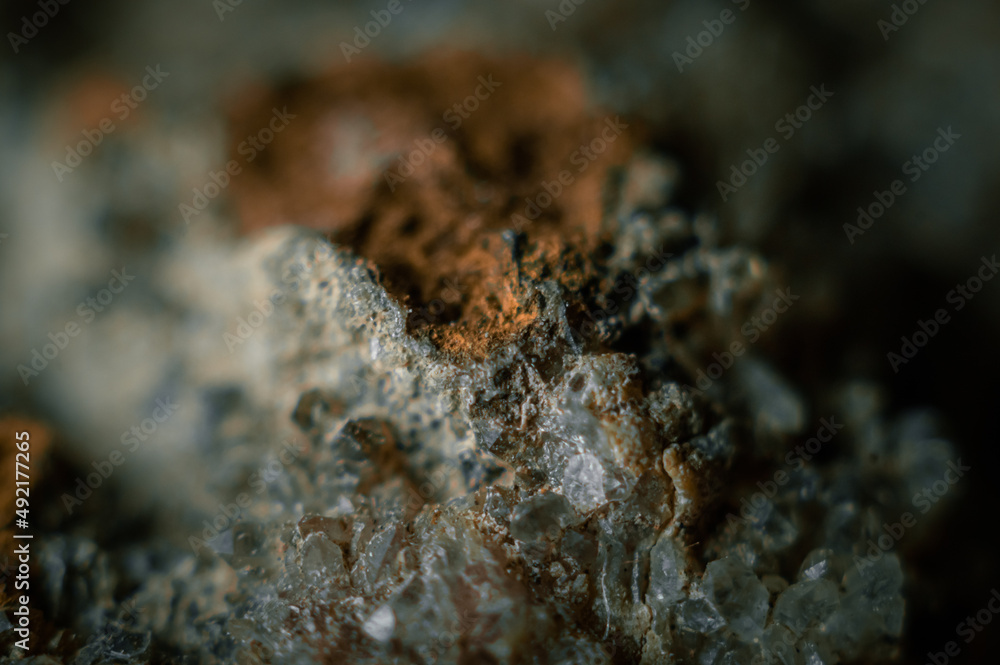 Blurred sample of rock with amethyst under great magnification. Mountain mineral with crystals. Selective focus. Macro, horizontal composition Blurred sample of rock with amethyst under great magnification. Mountain mineral with crystals. Selective focus. Macro, horizontal composition