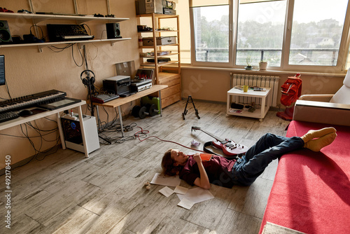 Fotografie Creative male songwriter thinking about new song