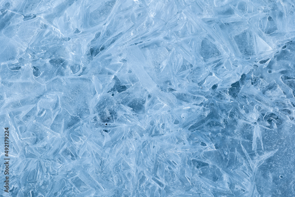 Texture of winter ice surface. Blue natural ice background. Texture of winter ice surface. Blue natural ice background.