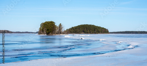 Frozen lake landscape in Farnebofjarden national park in north of Sweden,