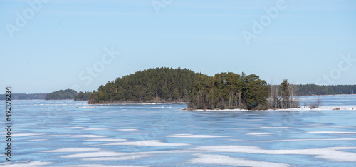 Frozen lake landscape in Farnebofjarden national park in north of Sweden,