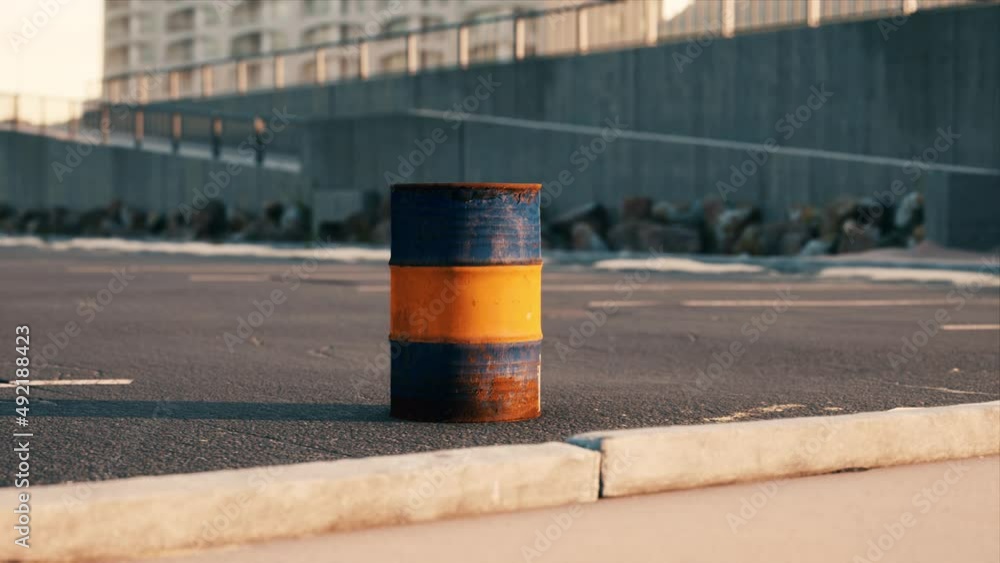 old and rusty metal barrel on parking old and rusty metal barrel on parking