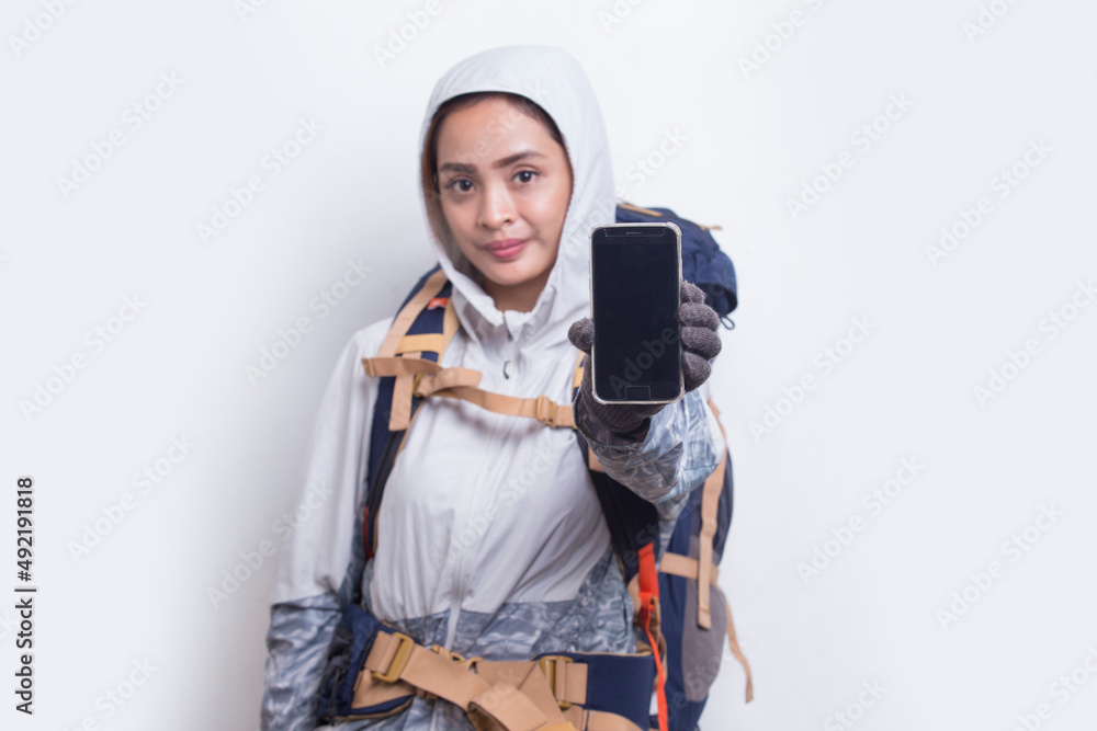 Young asian hiker woman showing mobile phone isolated on white background
Young asian hiker woman showing mobile phone isolated on white background